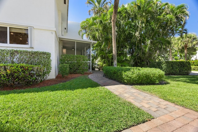 view of yard with a sunroom