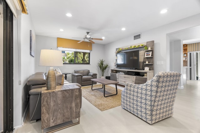 living area featuring recessed lighting, visible vents, and ceiling fan