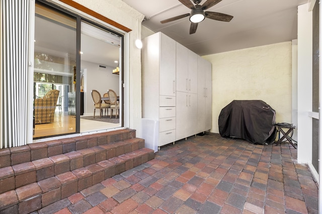 view of patio / terrace with area for grilling and ceiling fan