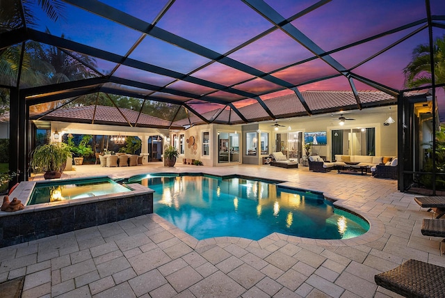 view of pool with outdoor lounge area, a patio, a ceiling fan, and a pool with connected hot tub