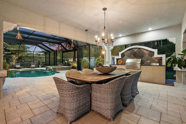 exterior space with a sunroom, stone tile floors, recessed lighting, a textured wall, and a textured ceiling