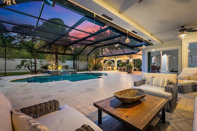 view of swimming pool with an outdoor living space, a pool with connected hot tub, a patio, and ceiling fan