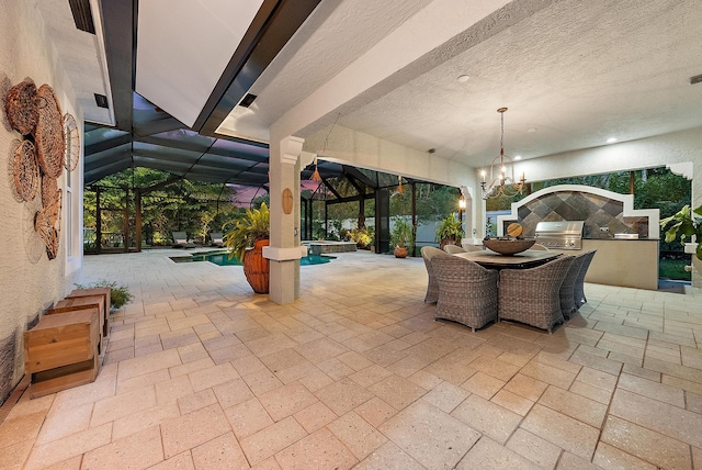 view of patio with a hot tub, a lanai, a grill, an outdoor kitchen, and an outdoor pool