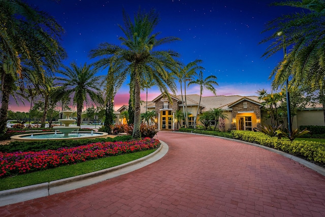 exterior space featuring decorative driveway