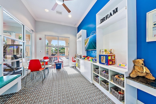 rec room featuring visible vents, ornamental molding, a ceiling fan, recessed lighting, and carpet