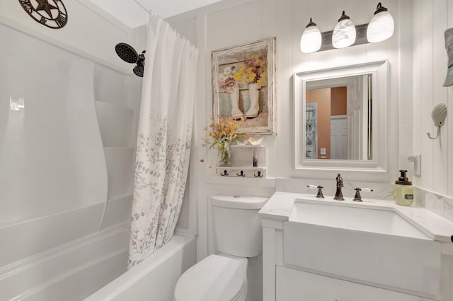 bathroom with vanity, toilet, and shower / bath combo