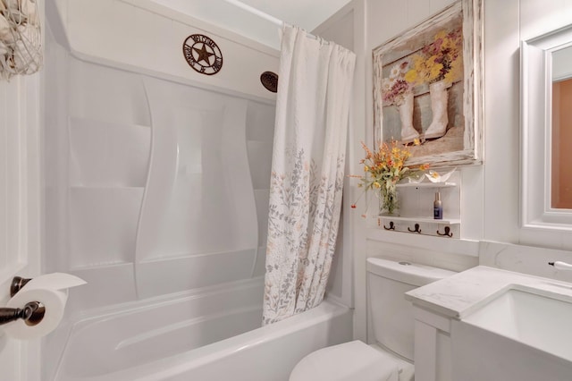 full bath featuring vanity, shower / bath combination with curtain, and toilet