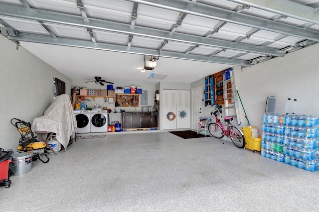 garage featuring electric panel, a garage door opener, and separate washer and dryer