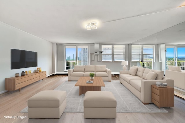 living room featuring light wood-type flooring and baseboards