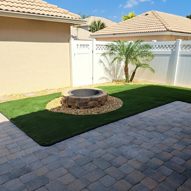 view of yard featuring a patio and fence