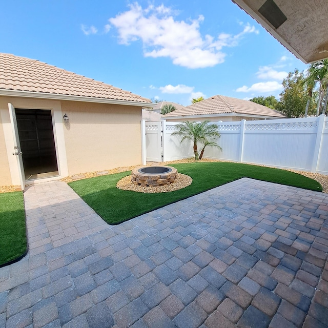 view of patio featuring a gate and fence