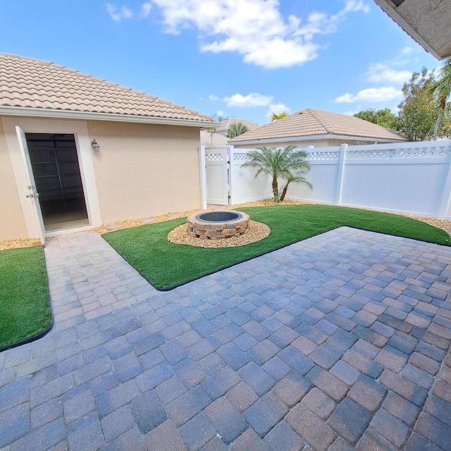 view of patio / terrace with a gate and fence