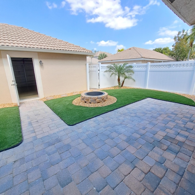 view of patio / terrace featuring fence and a gate