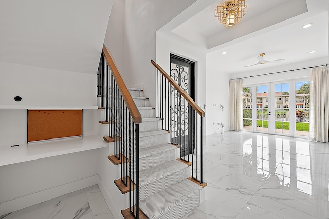 foyer featuring stairway, recessed lighting, french doors, and marble finish floor