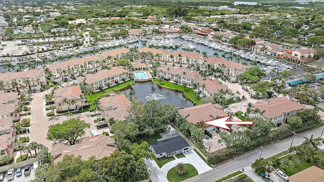 birds eye view of property featuring a residential view and a water view