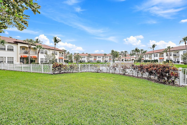 view of yard featuring a residential view and fence