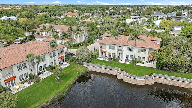 birds eye view of property with a residential view and a water view