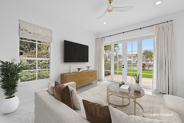 living room featuring recessed lighting, french doors, marble finish floor, and ceiling fan