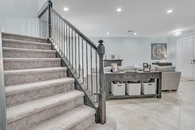 stairway with visible vents and recessed lighting