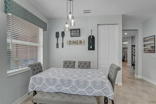 dining area with visible vents and baseboards