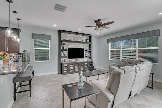 living room featuring recessed lighting, visible vents, a healthy amount of sunlight, and ceiling fan