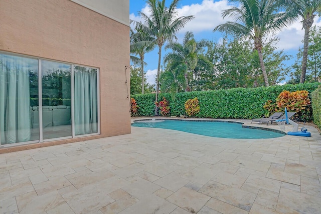 view of pool with a patio area and a fenced in pool