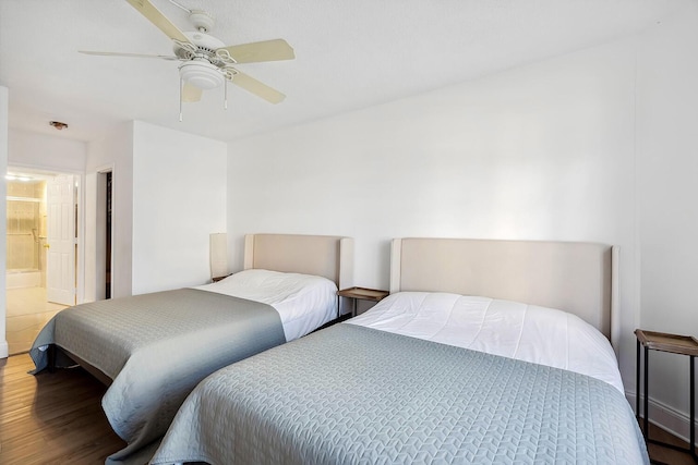 bedroom featuring wood finished floors and ceiling fan