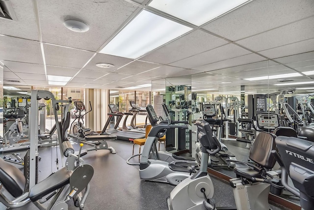 workout area featuring a paneled ceiling