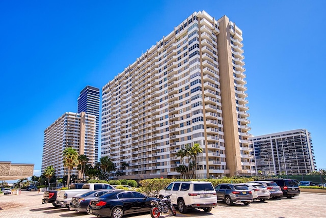 view of property featuring uncovered parking