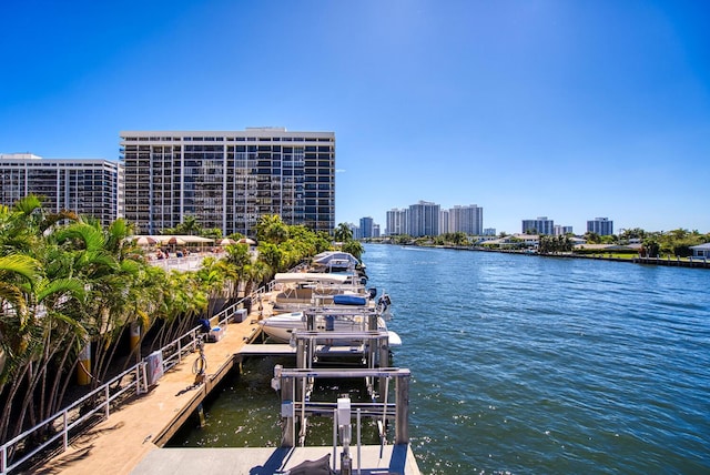 dock area featuring a view of city and a water view