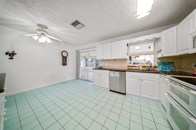 kitchen featuring visible vents, dishwasher, ceiling fan, a sink, and range with two ovens