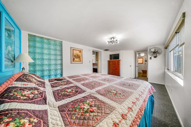 carpeted bedroom with baseboards