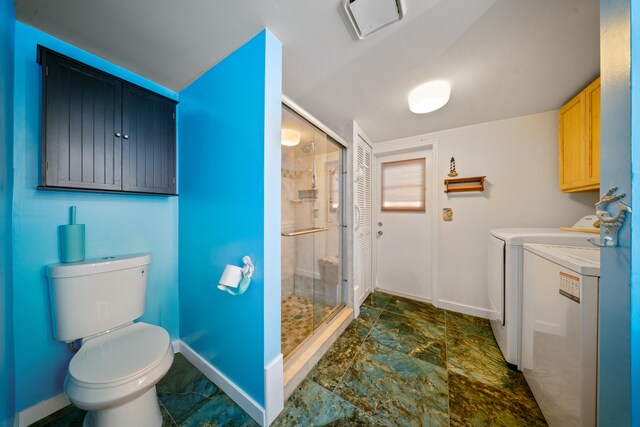 311 Granada St, Fort Pierce, FL 34949 - full bath featuring washing machine and dryer, baseboards, a shower stall, and toilet