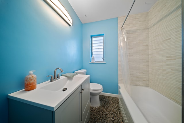 full bath featuring toilet, shower / bath combo, baseboards, and vanity