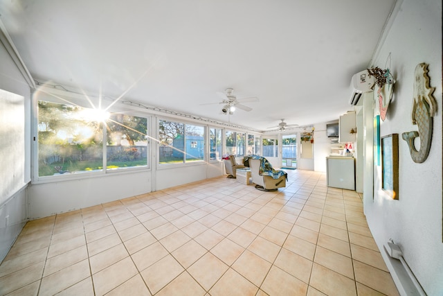 unfurnished sunroom featuring tile patterned floors, an AC wall unit, and a ceiling fan