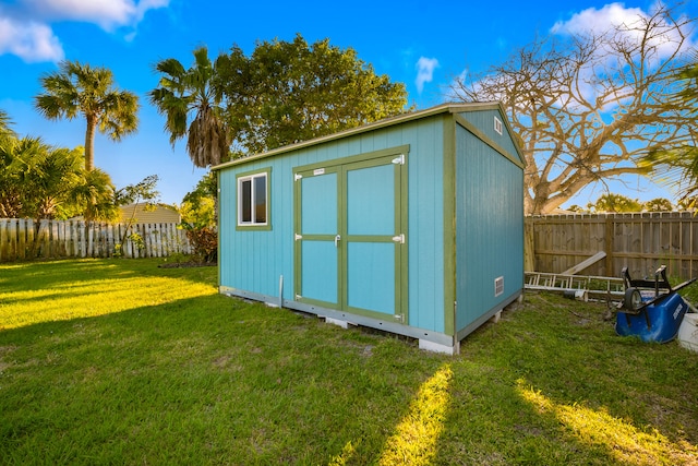 view of shed featuring a fenced backyard