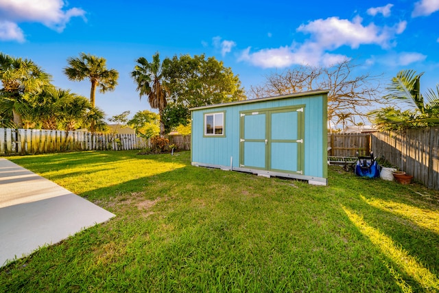 view of shed with a fenced backyard