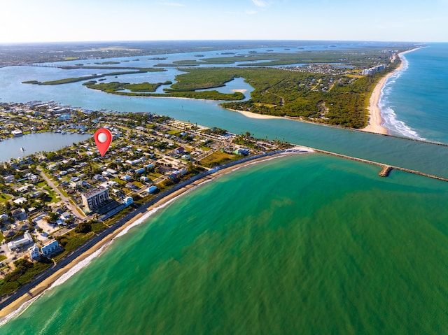 bird's eye view featuring a view of the beach and a water view