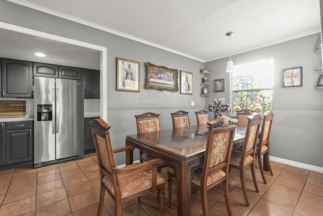 dining space featuring baseboards and ornamental molding