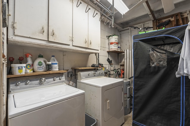 832 Lytle St, West Palm Beach, FL 33405 - laundry room with washing machine and clothes dryer and cabinet space