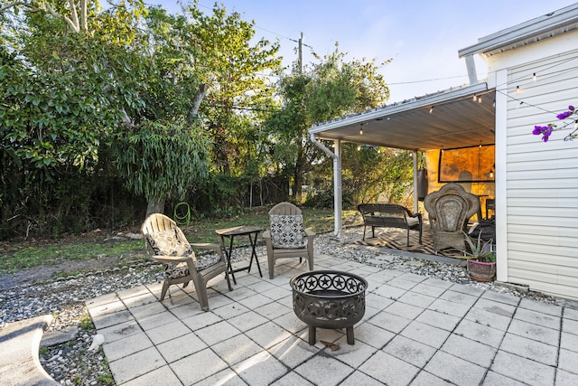 view of patio / terrace with an outdoor fire pit