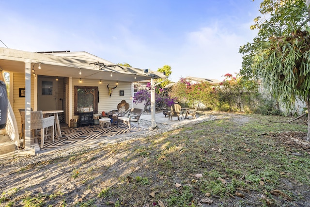 832 Lytle St, West Palm Beach, FL 33405 - view of yard featuring a patio and an outdoor living space with a fire pit