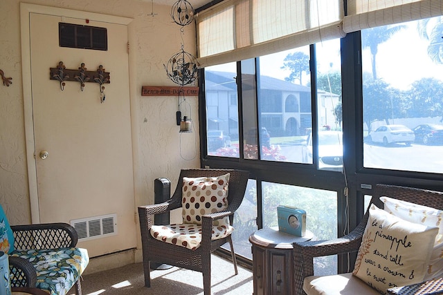 sunroom / solarium with visible vents