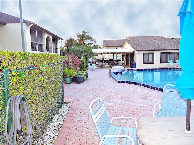 community pool with a patio