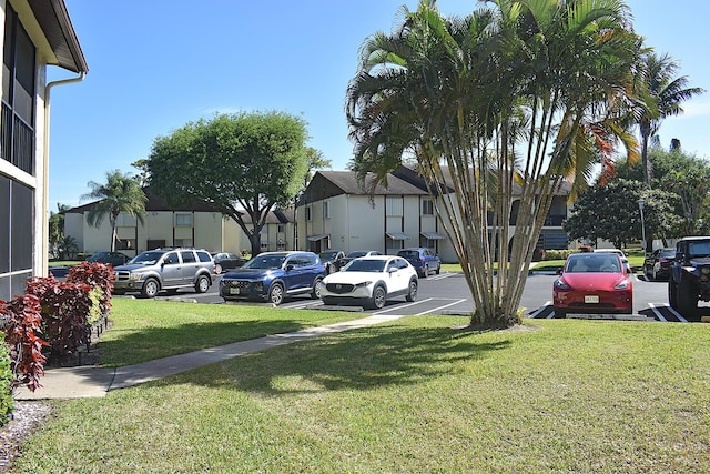 view of parking with a residential view