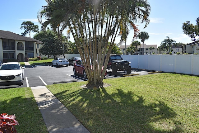 view of yard with fence and a residential view