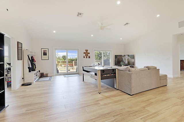 living room with light wood-style flooring, recessed lighting, and visible vents