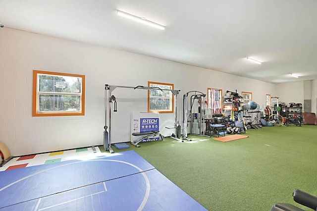 workout area featuring concrete block wall