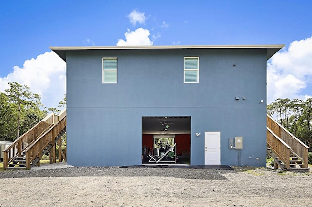 rear view of house with stairway