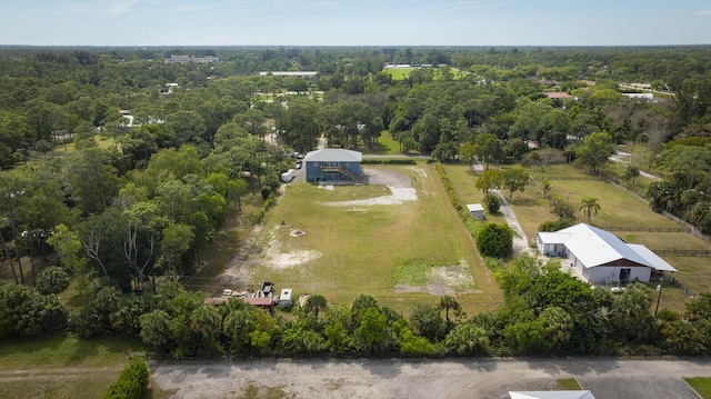 drone / aerial view featuring a view of trees